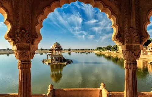 Indian landmark Gadi Sagar - artificial lake view through arch. Jaisalmer, Rajasthan, India